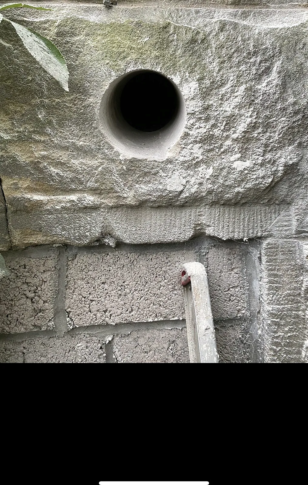 Cable entry sealed through brickwork during electrical first fix in Glasgow