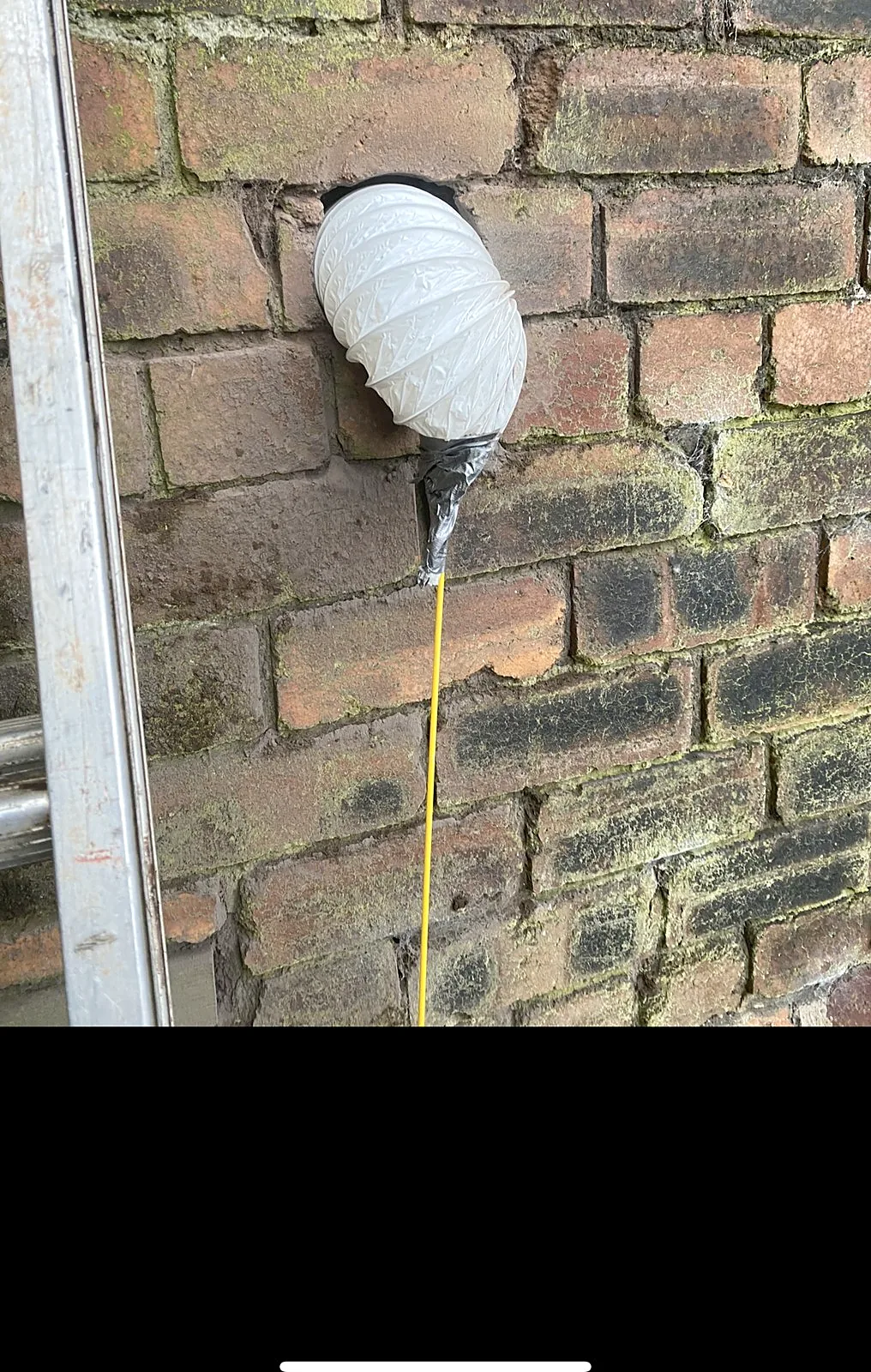 Core-drilled cable entry through sandstone during a rewire in Glasgow