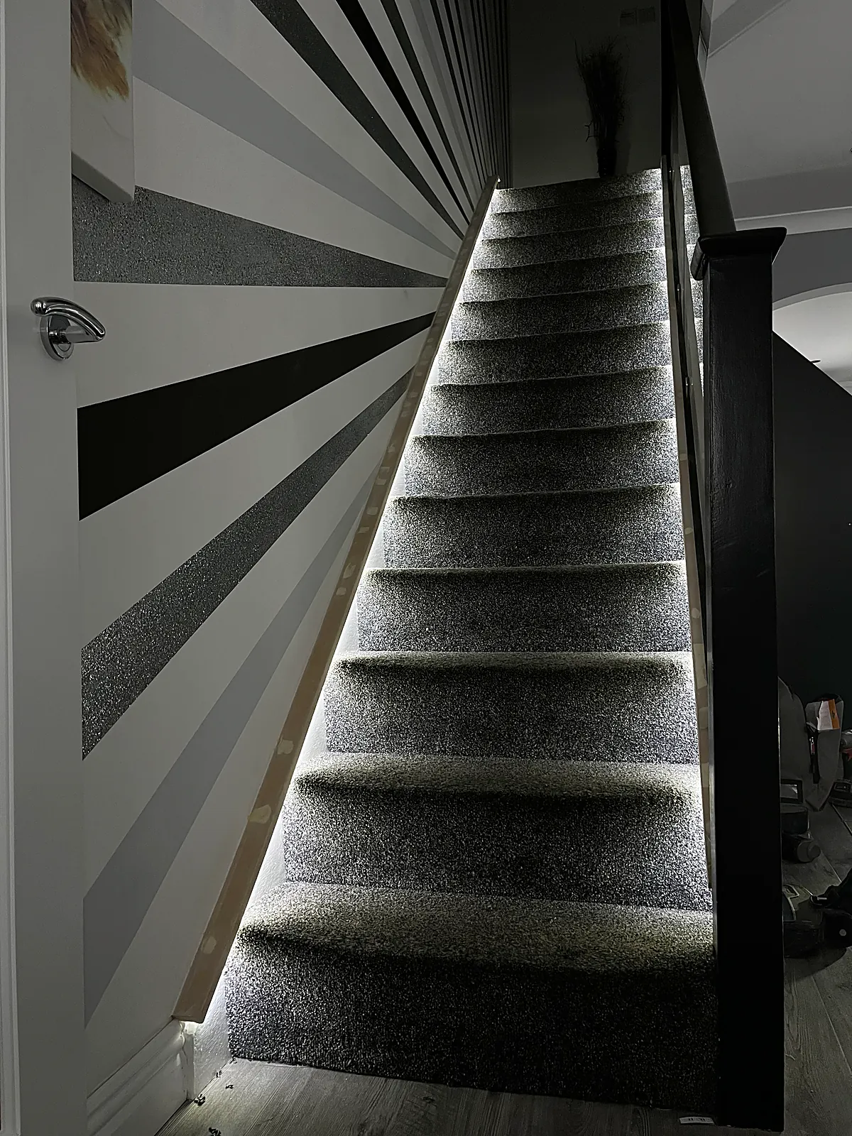 Recessed step lighting picking out the treads of a staircase