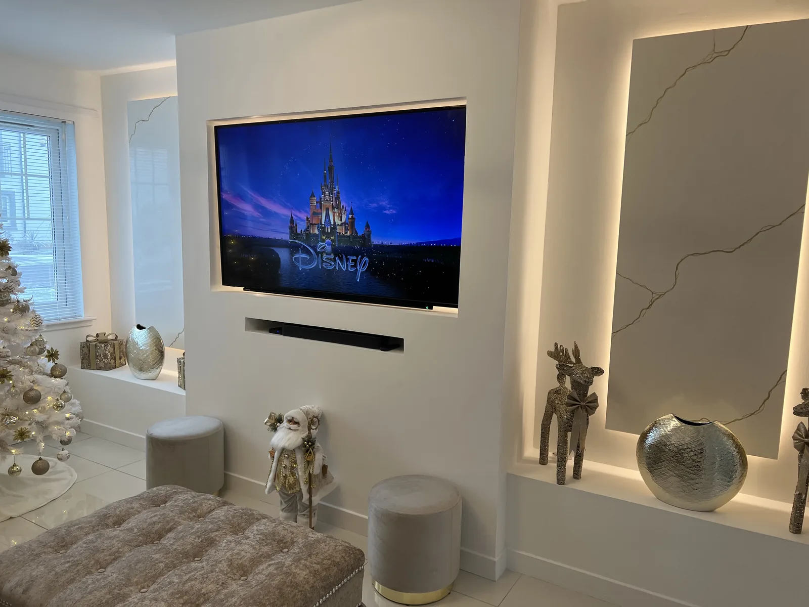 Recessed television with concealed cabling and backlit niches, electrical installation by MMM Electrical